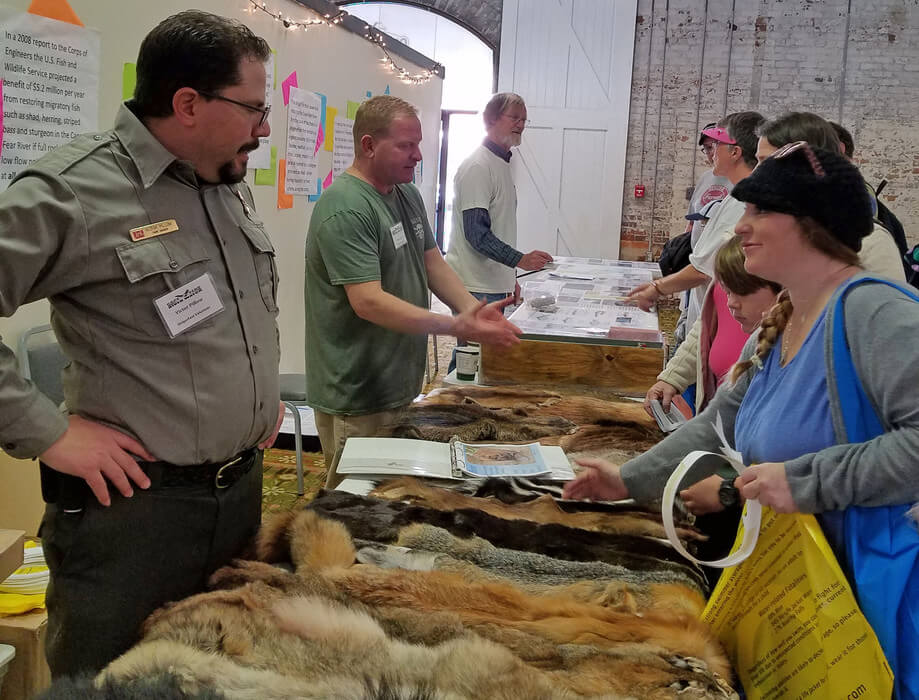 Corps staff converse with visitors about various plants, animals, and fish that can be found at the Wilmington District Locks and Dams on the Cape Fear River.