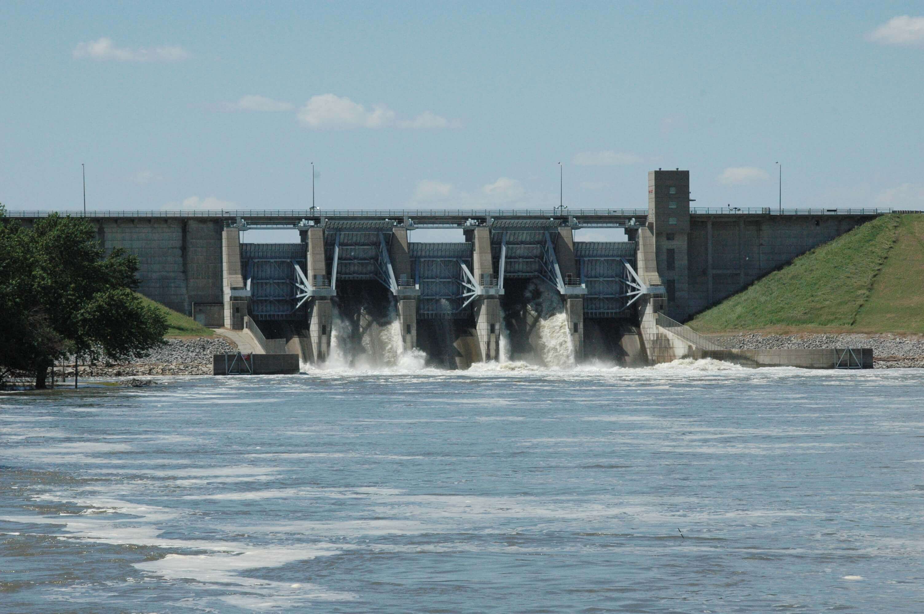 Water flows through the radial gates at Lake Red Rock during high water. Reservoir outflows and impounded water in the pool influence fish, mussels, and other wildlife that depend on the river’s aquatic, riparian, and floodplain habitats.