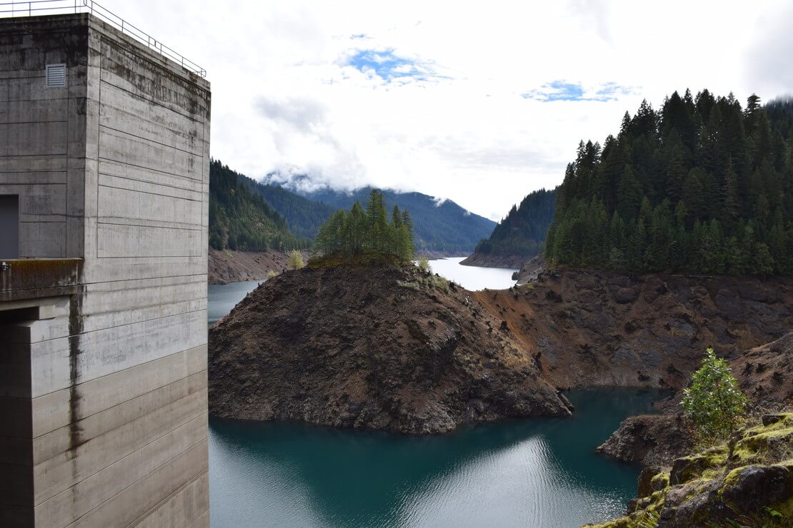 The U.S. Army Corps of Engineers built a temperature control tower (see structure to left in photo) in 2005 at Cougar Dam to allow for management of outflow temperatures for salmon and other aquatic species. 